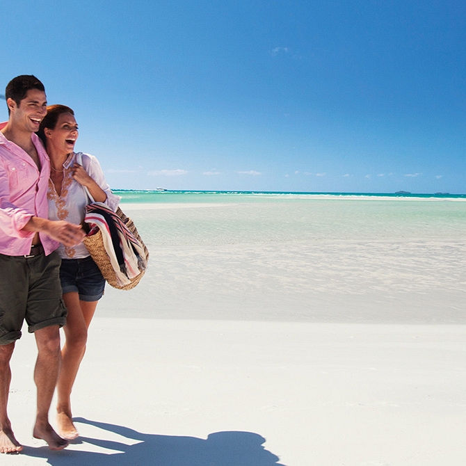 Couple on Whitehaven Beach, Australia - Bucket List Vacations - Australia, New Zealand, Fiji, Tahiti, Cook Islands Luxury Travel Agency