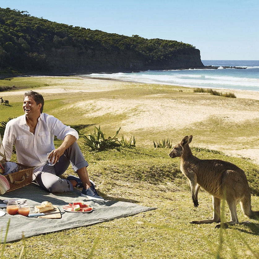 best multi destination travel packages - Pebbly beach couple - Kangaroo beach