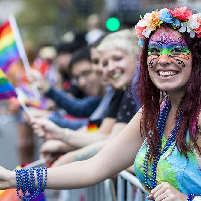 Woman Holding a Rainbow LGBT+ Pride Flag at the Sydney Gay and Lesbian Mardi Gras Parade